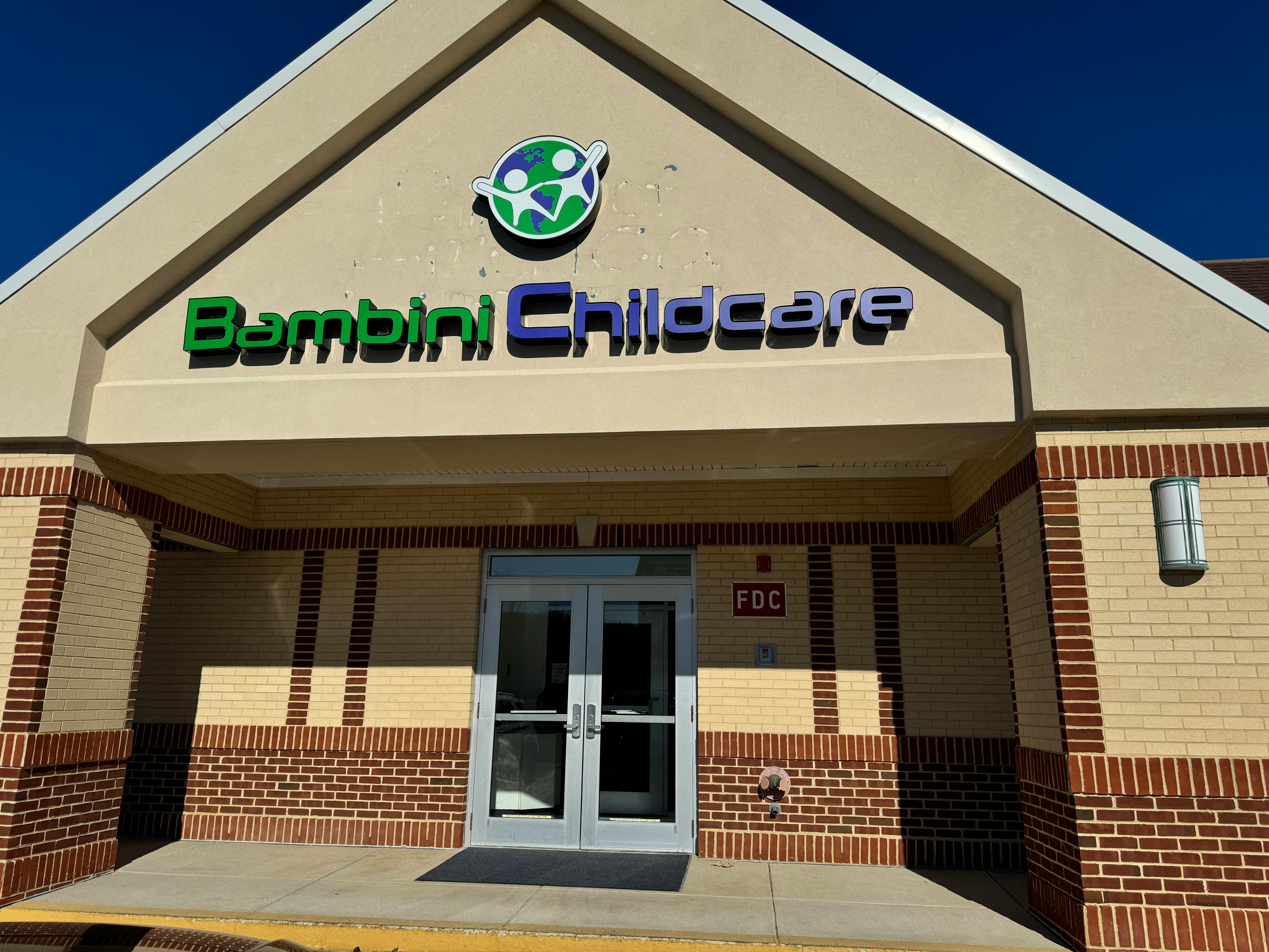 Bambini Childcare sign on a building facade