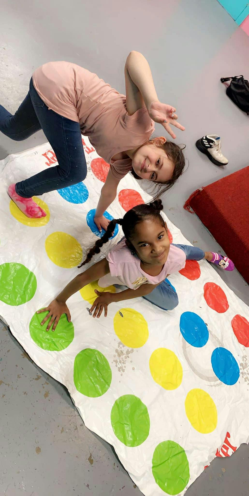Two children playing Twister
