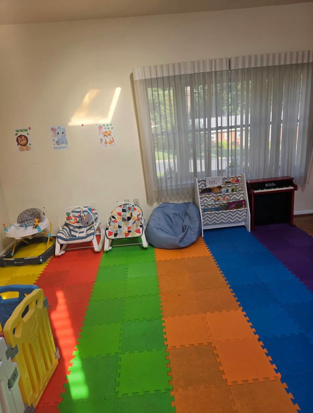 Multicolor foam floor mats with infant bouncers and children room furniture