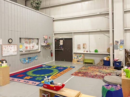 Colorful rugs and toys in a child activity room