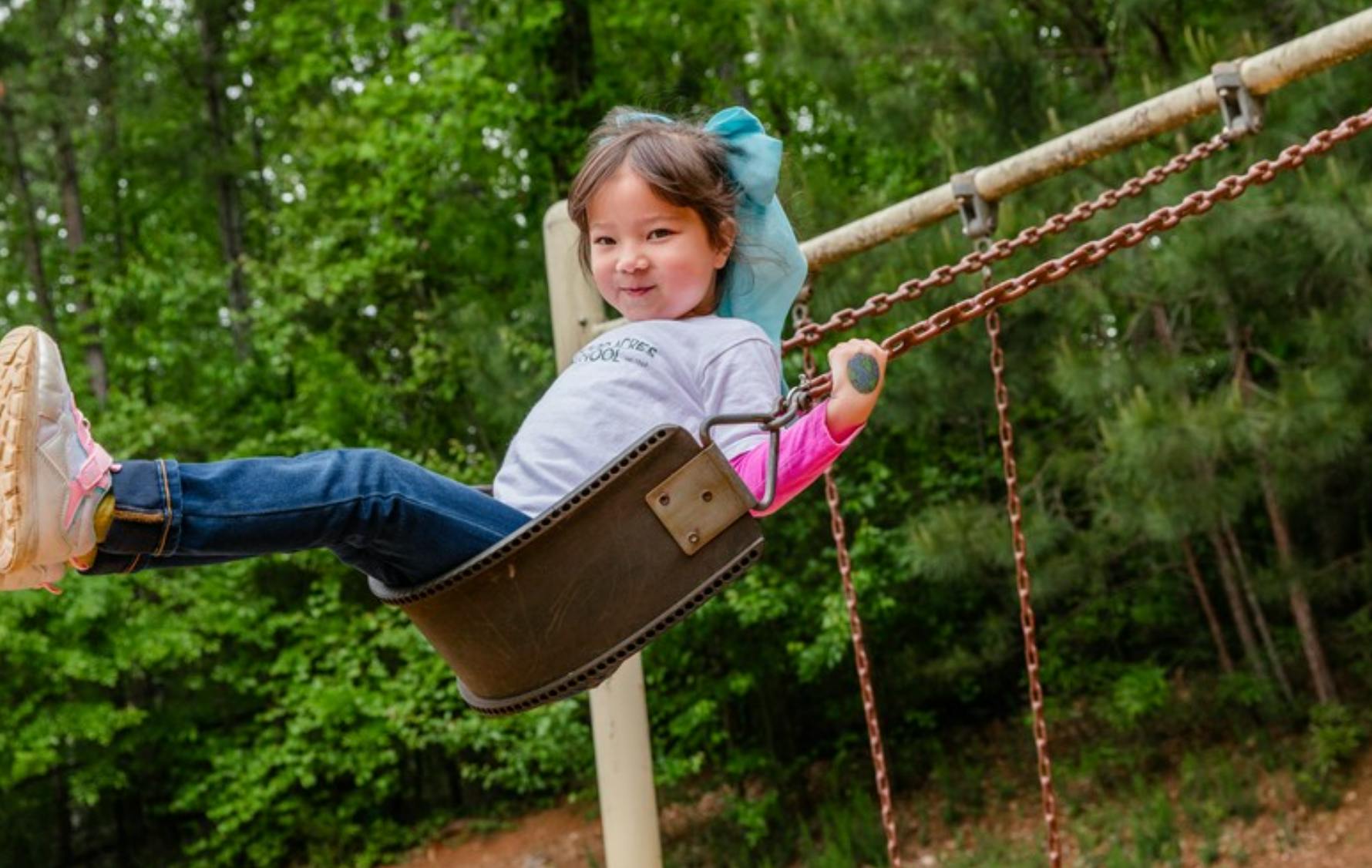 Child on a swing at a playground