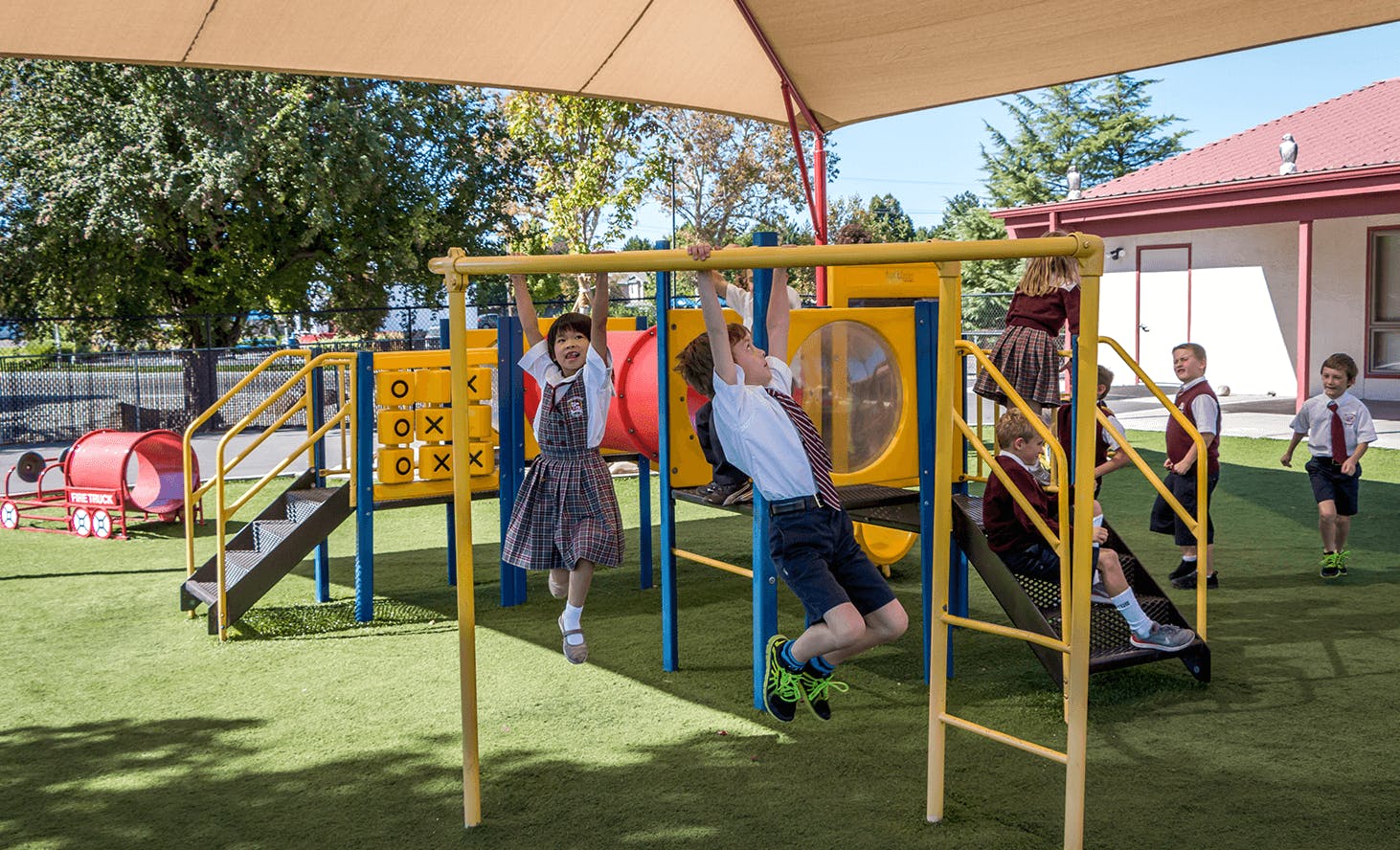Children playing on a playground structure