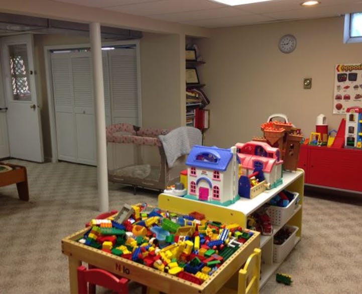 Playroom with toy houses and building blocks on a table