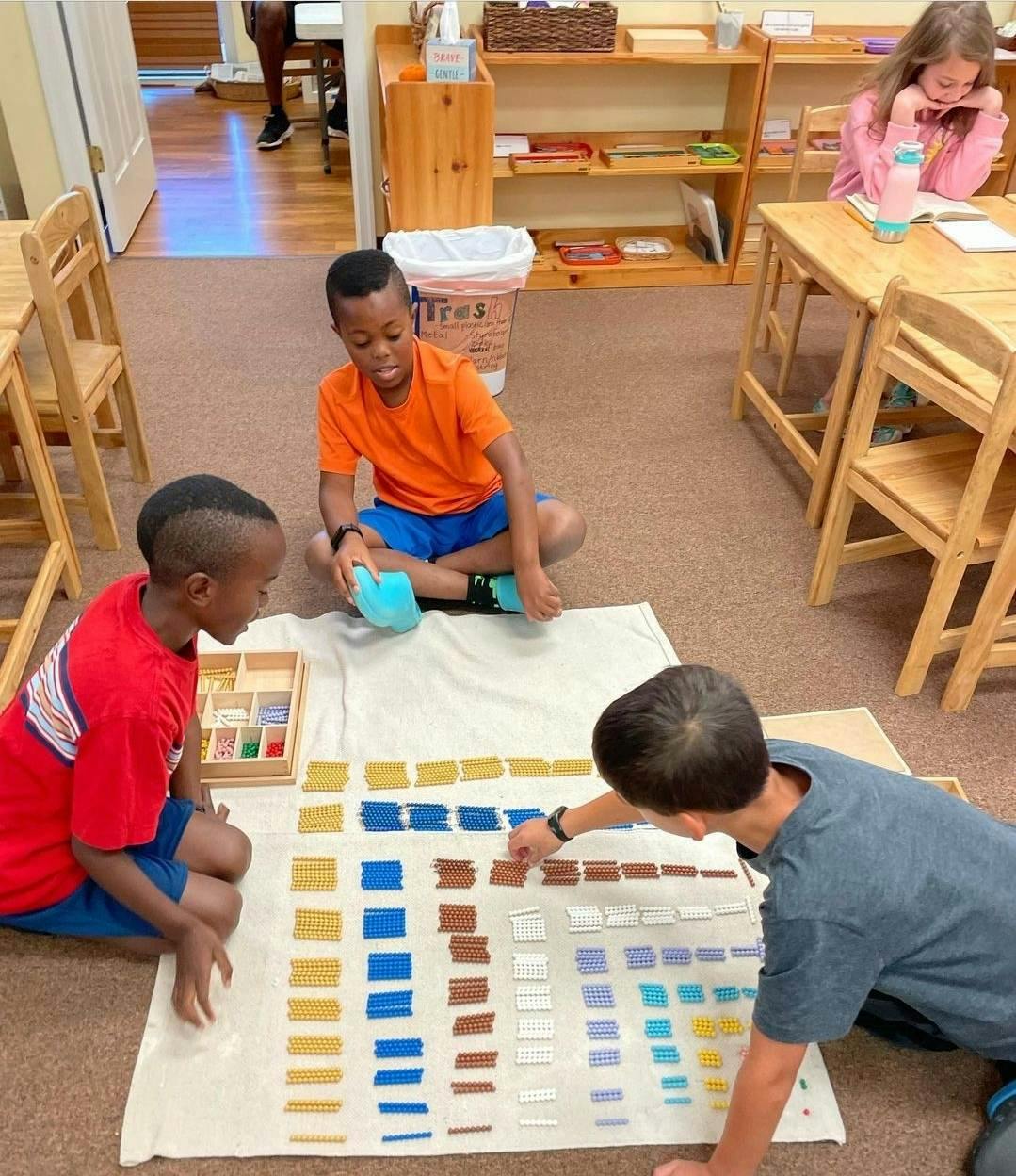 Children on floor playing with colorful blocks