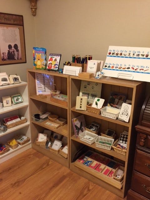 Shelves filled with various learning materials and books in a classroom