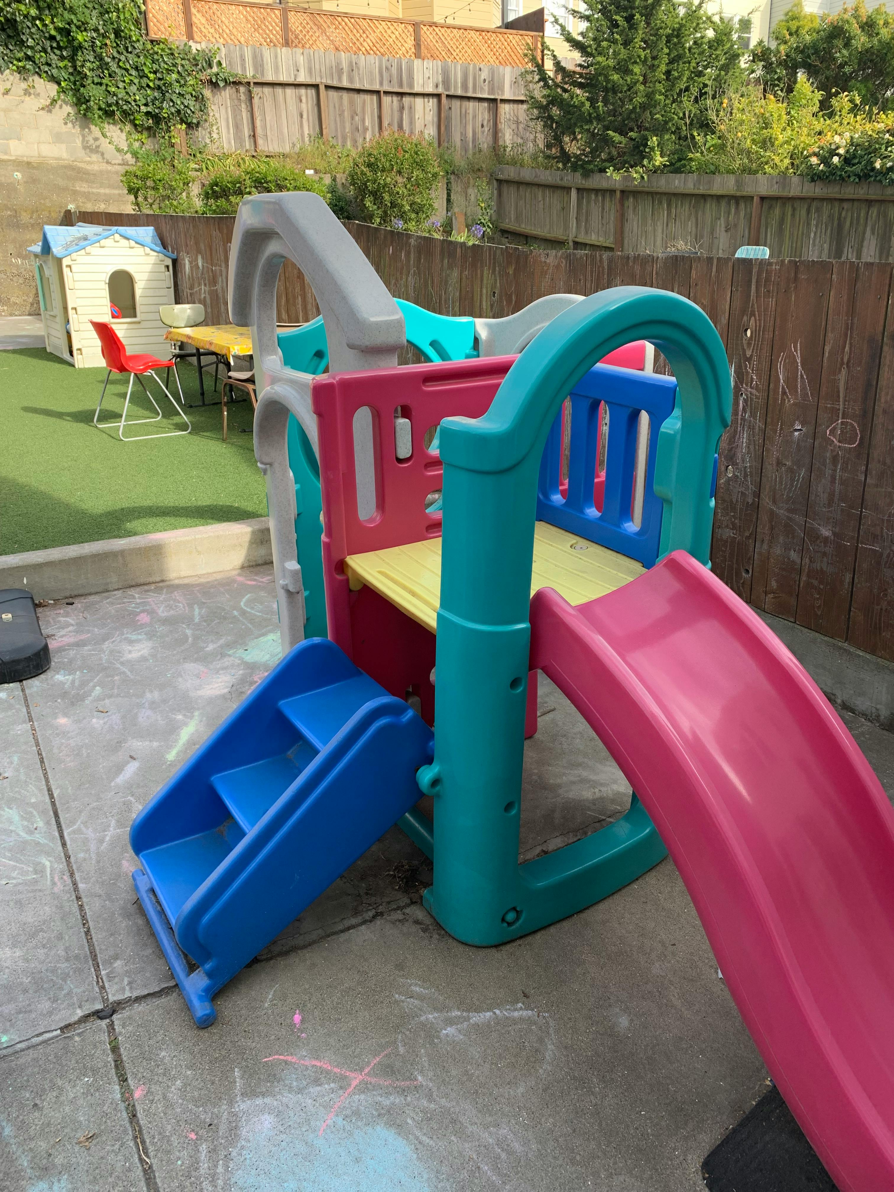 Colorful plastic playground structure with slide and steps