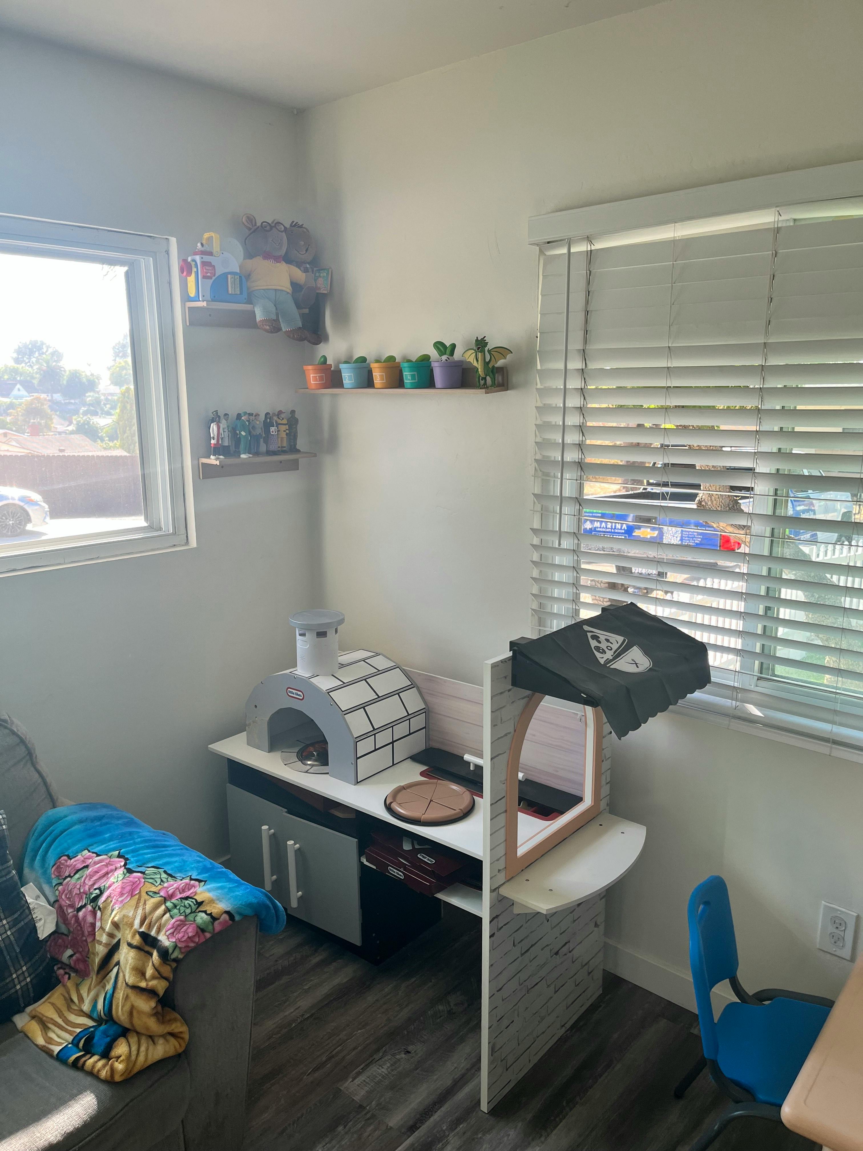 Cat tree and cat house next to a window