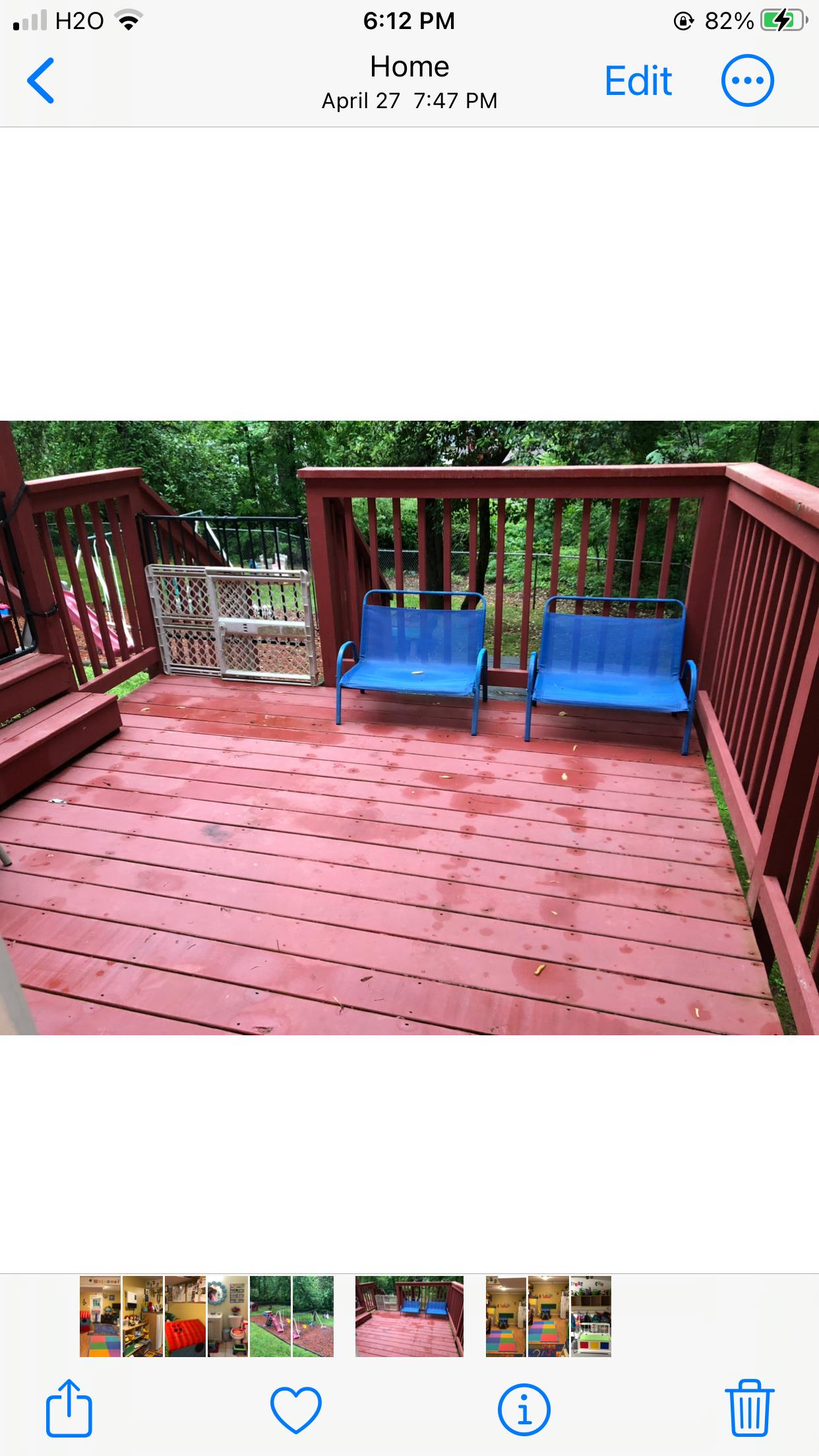 Two blue benches on a red wooden deck