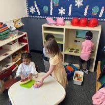 Children playing with toys in a classroom
