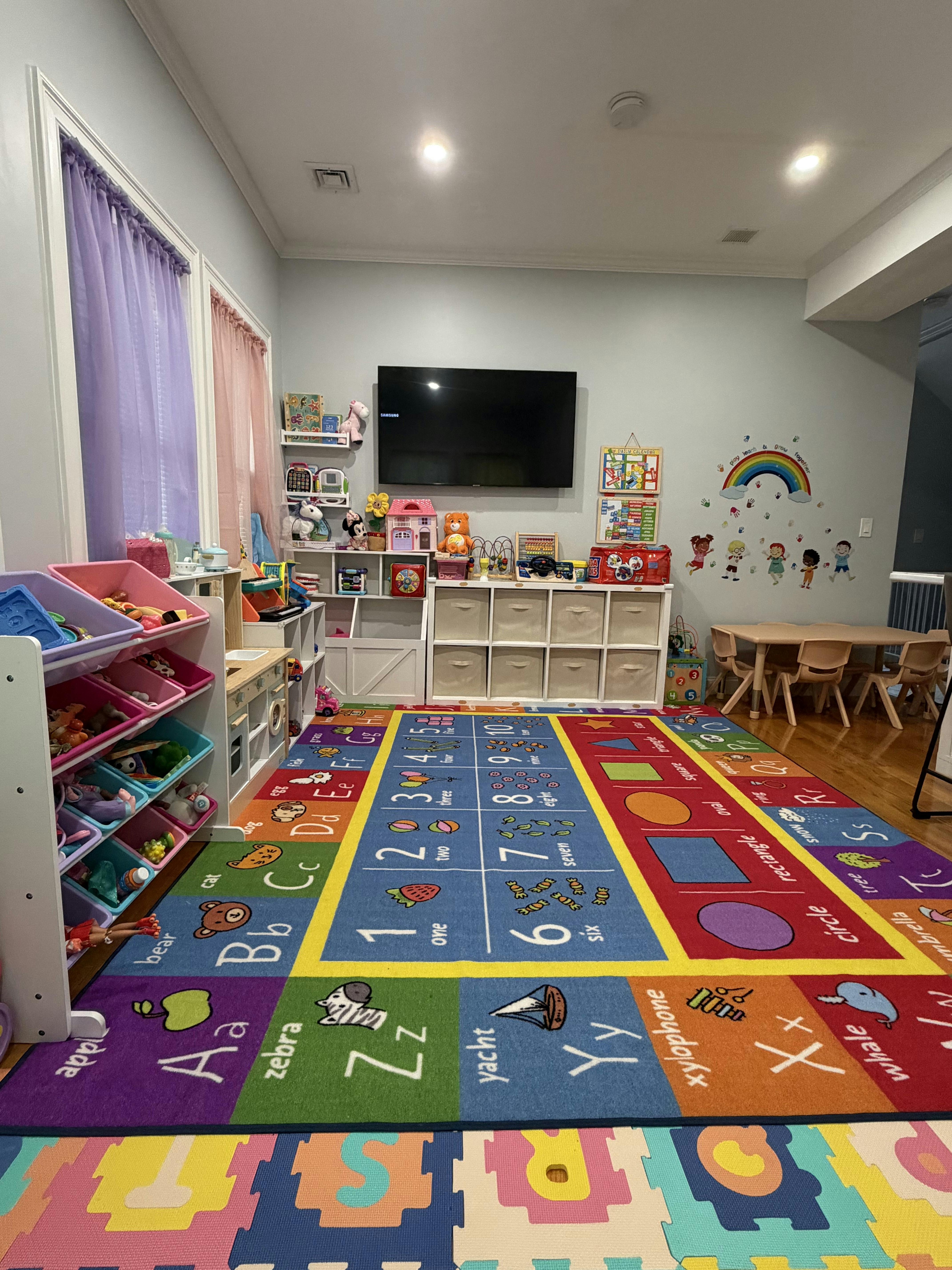 Colorful playroom with an alphabet and number rug