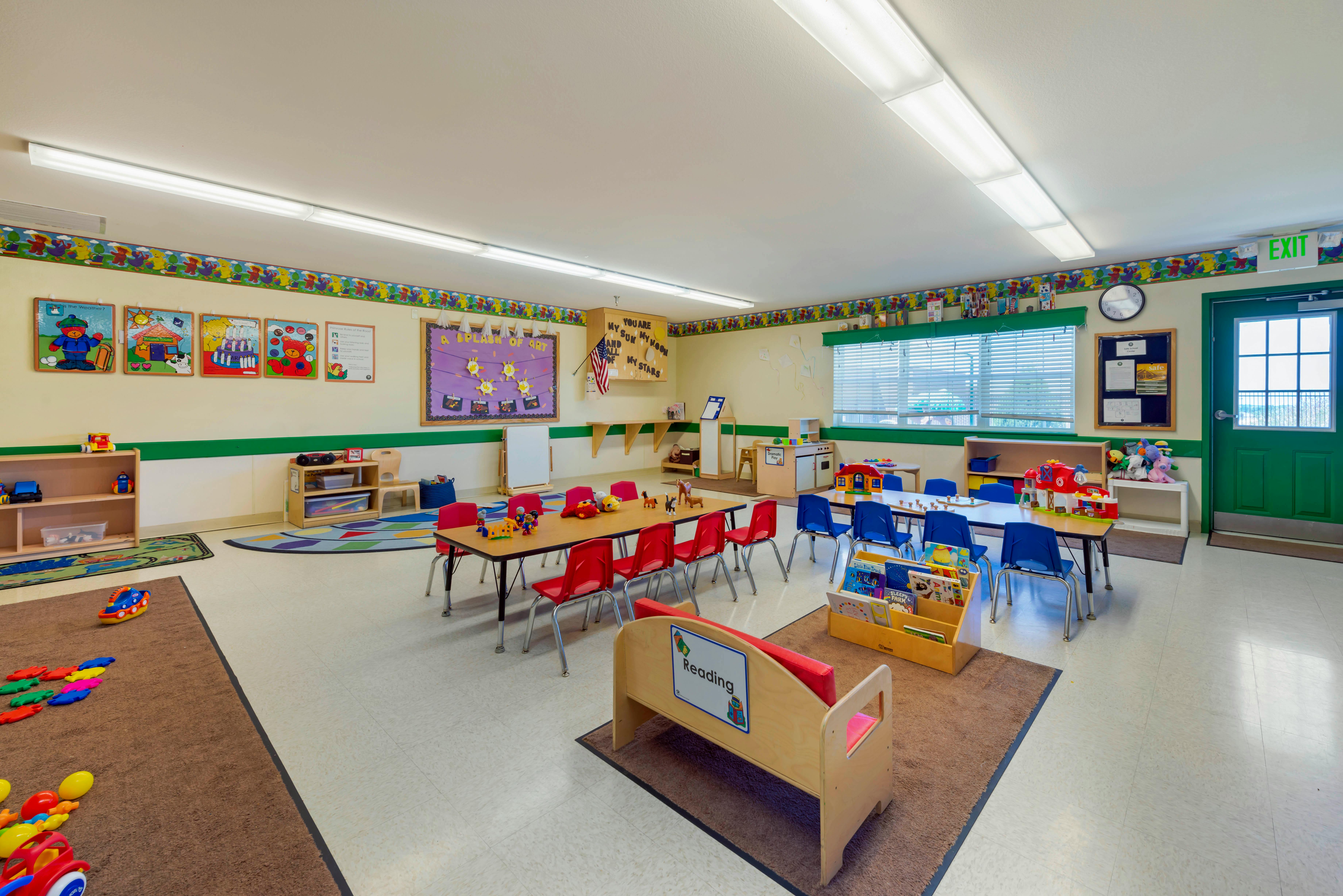 Colorful and organized classroom with small tables and chairs