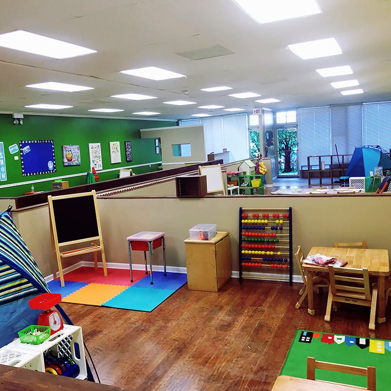 Classroom with various learning stations and play areas