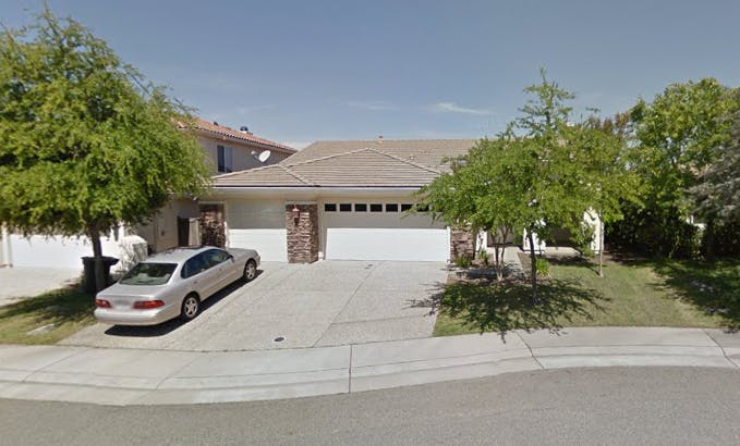 House with a car parked in the driveway