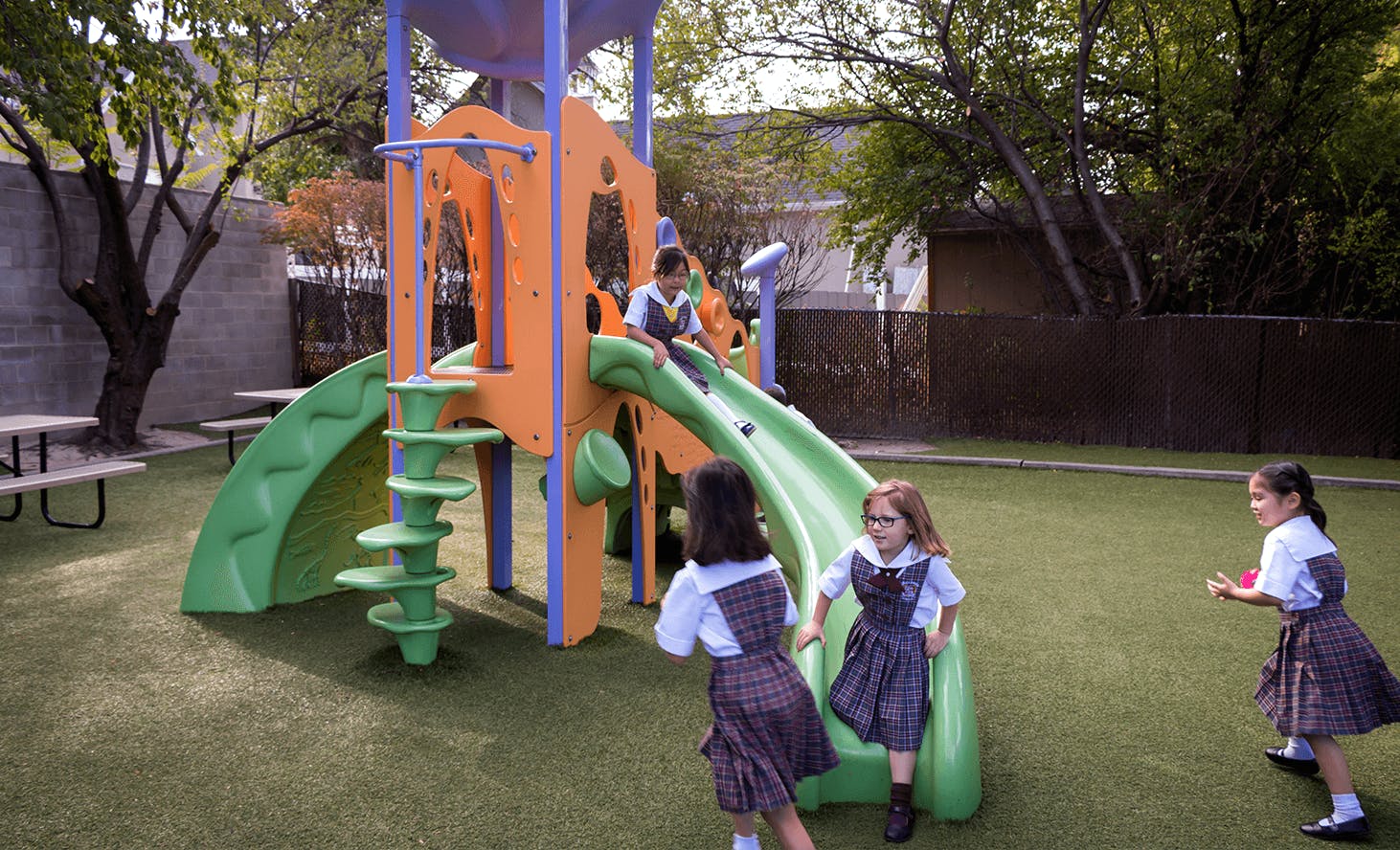 Children playing on a playground slide