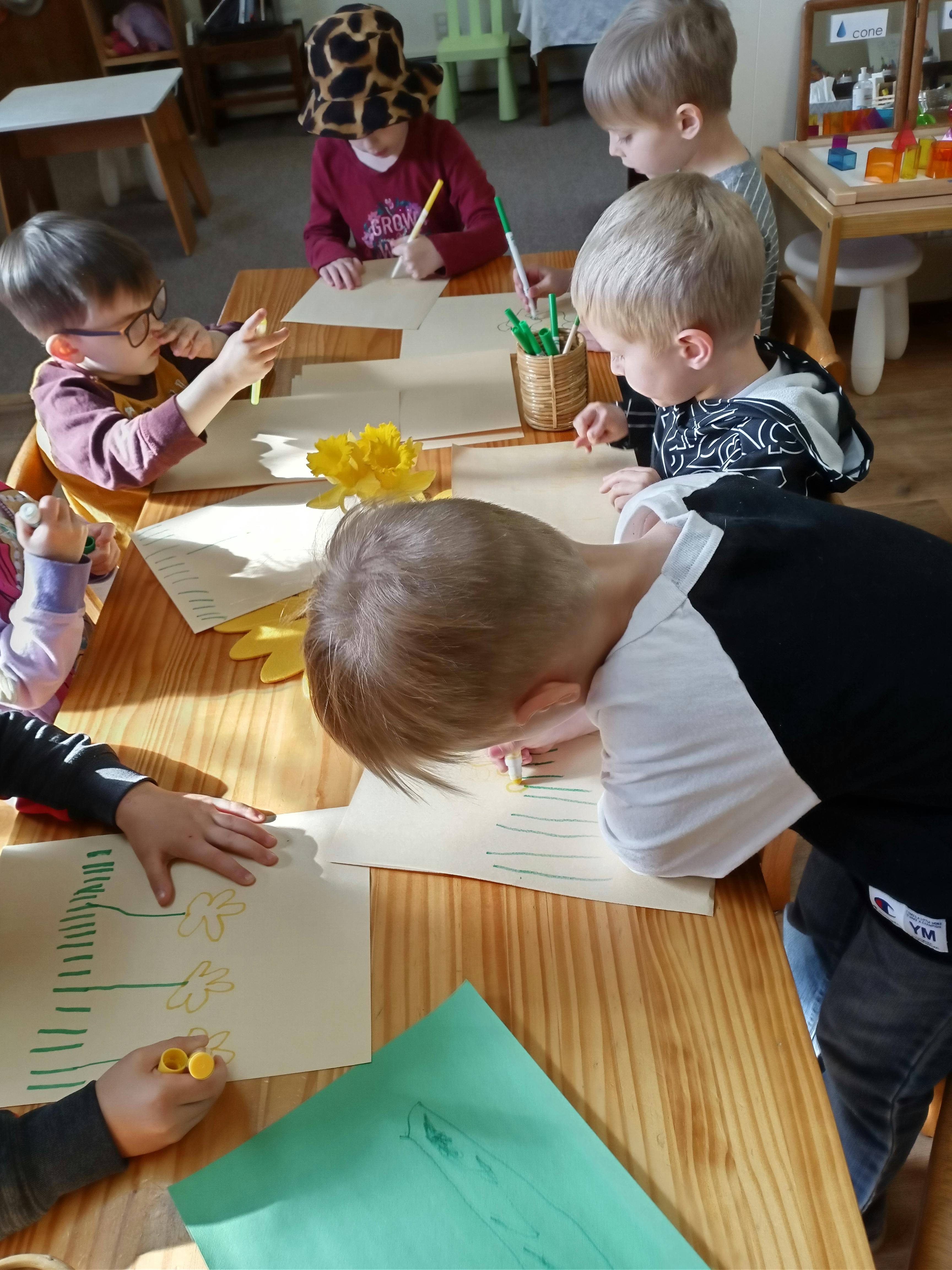 Children drawing at a table