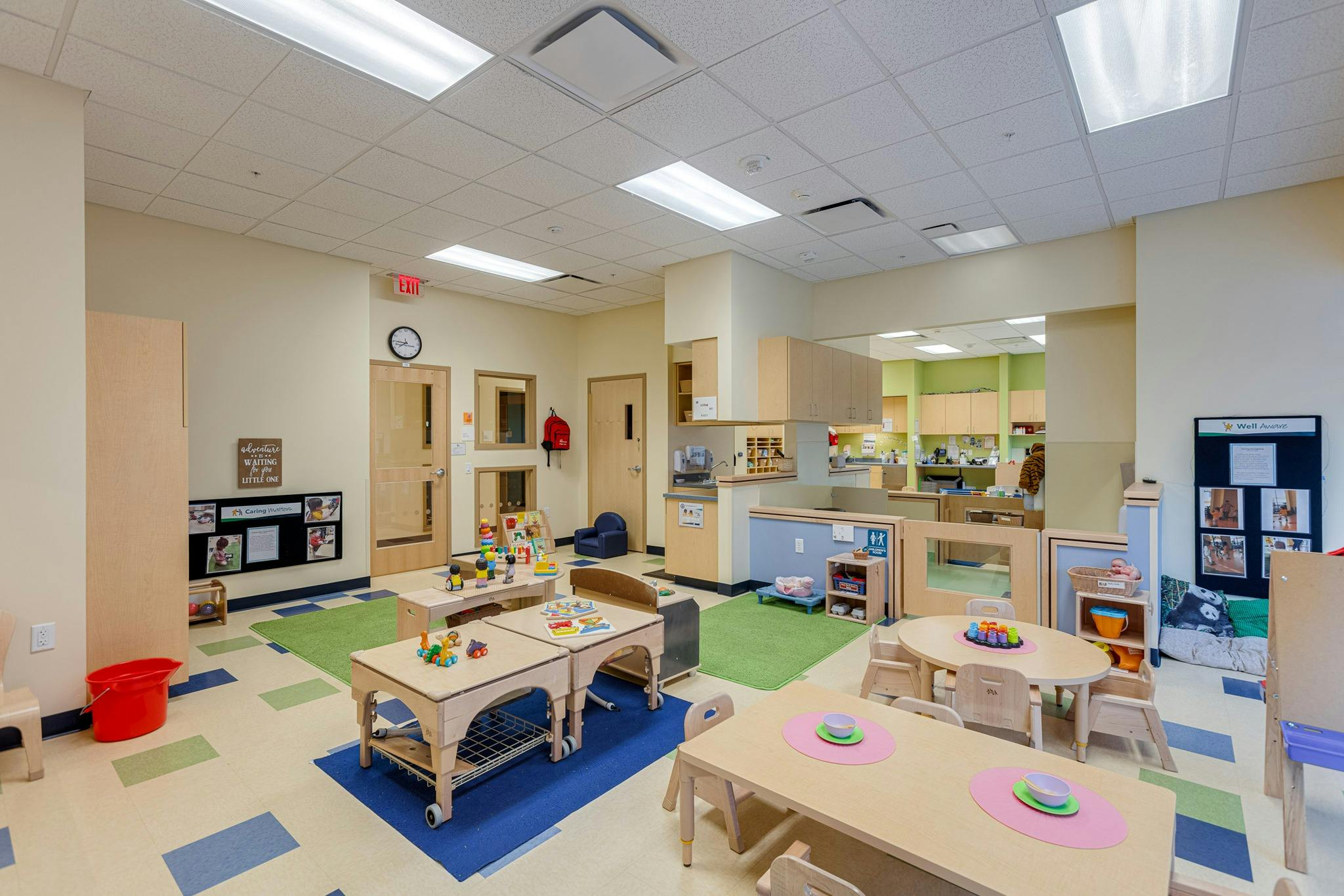 Empty classroom with small tables and chairs