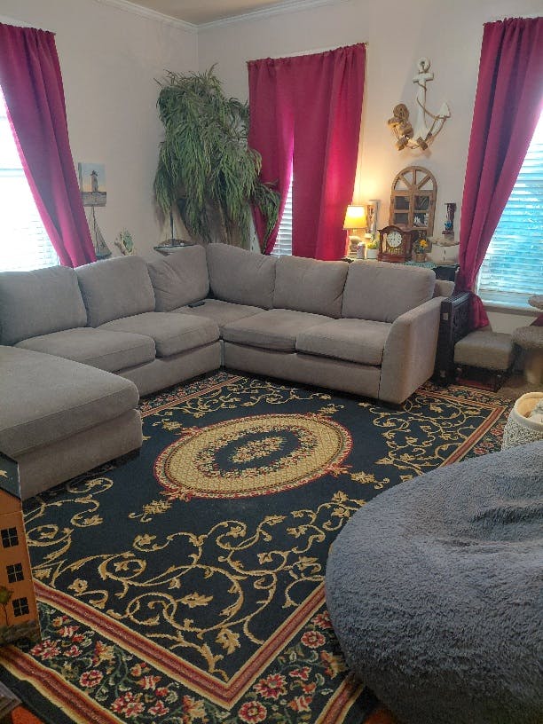 Sectional sofa and area rug in a living room