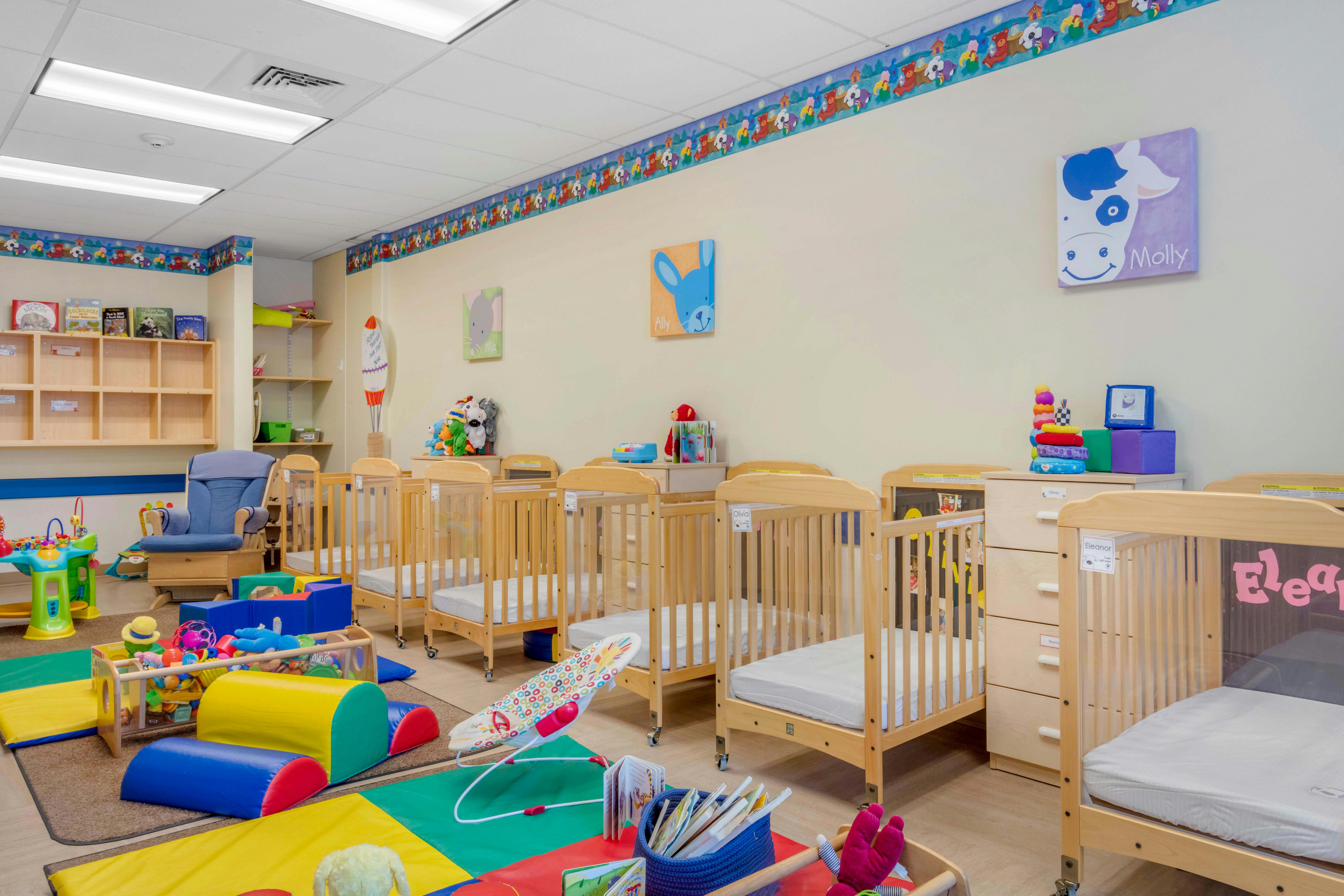 Cots and play equipment in a child care classroom