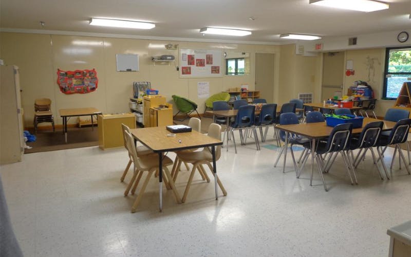 Classroom with child-sized tables and chairs