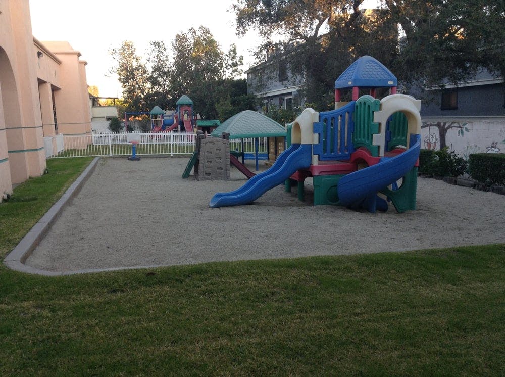 Playground with slides and climbing structures on sand