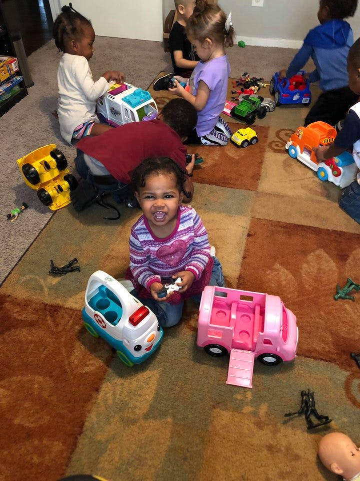 Children playing with toys on a carpeted carpet