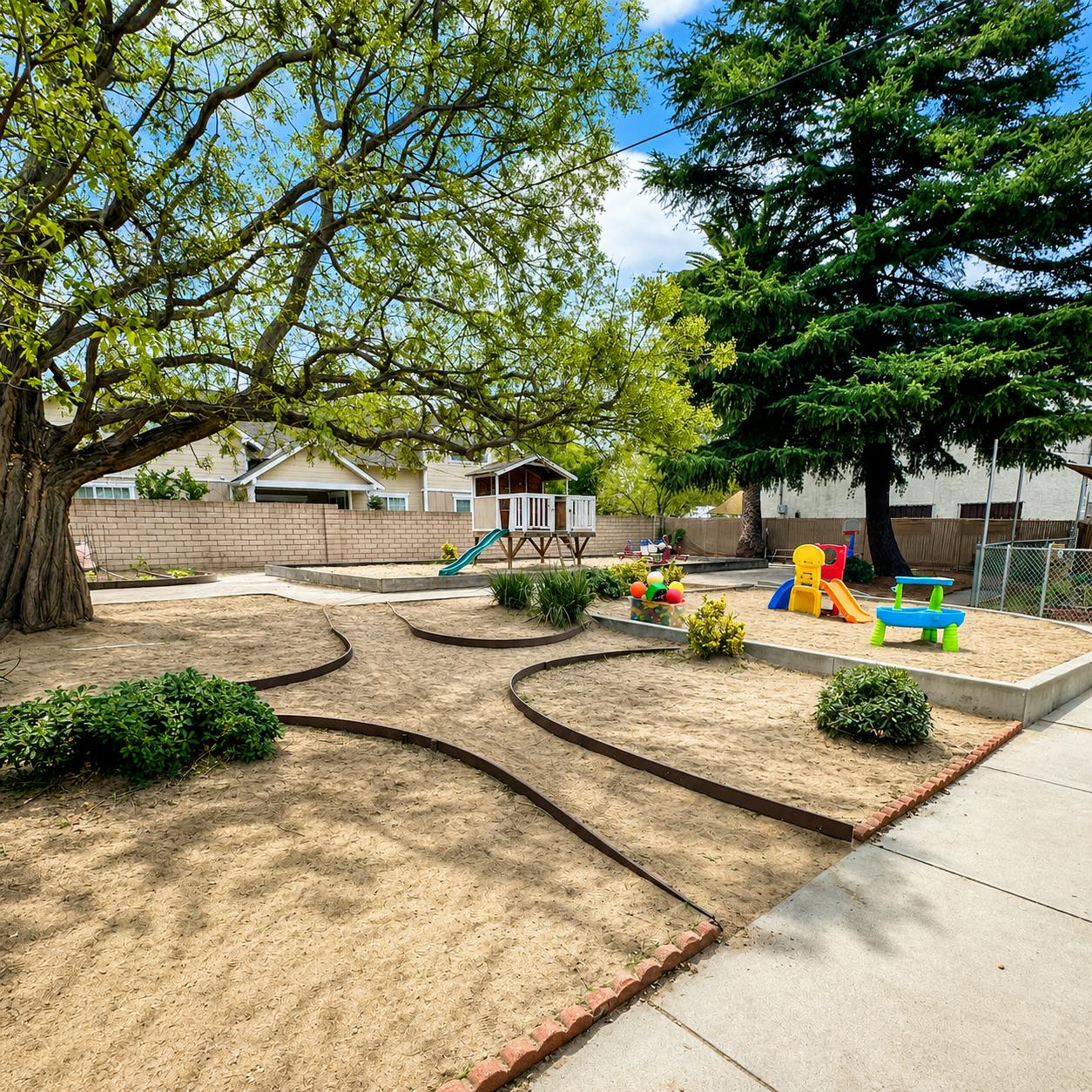 Playground with sand pits, small play structures, and trees