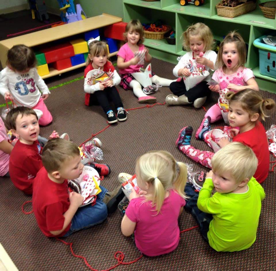 Children sitting in a circle on the floor