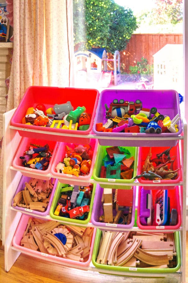 Toy organizer with colorful bins filled with various toys