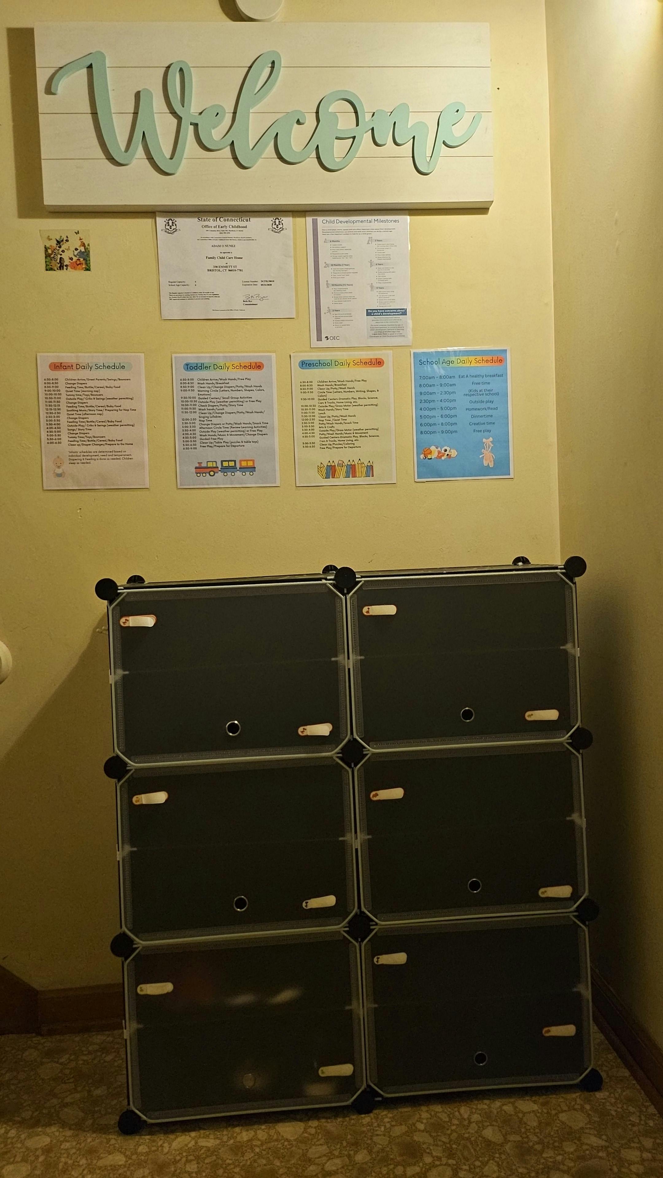 Welcome sign above papers and storage cubes