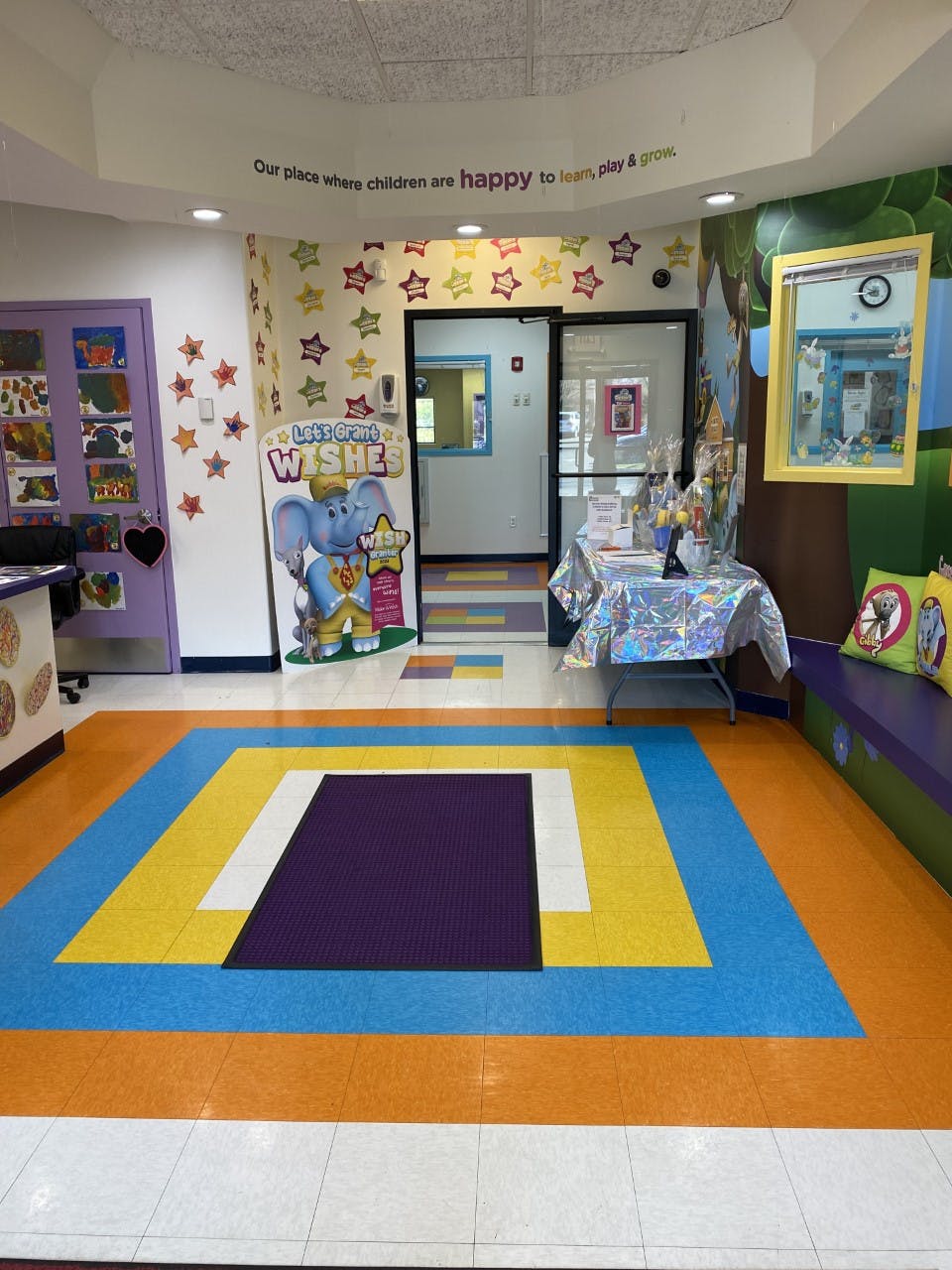Colorful room with geometric floor pattern and wall decorations
