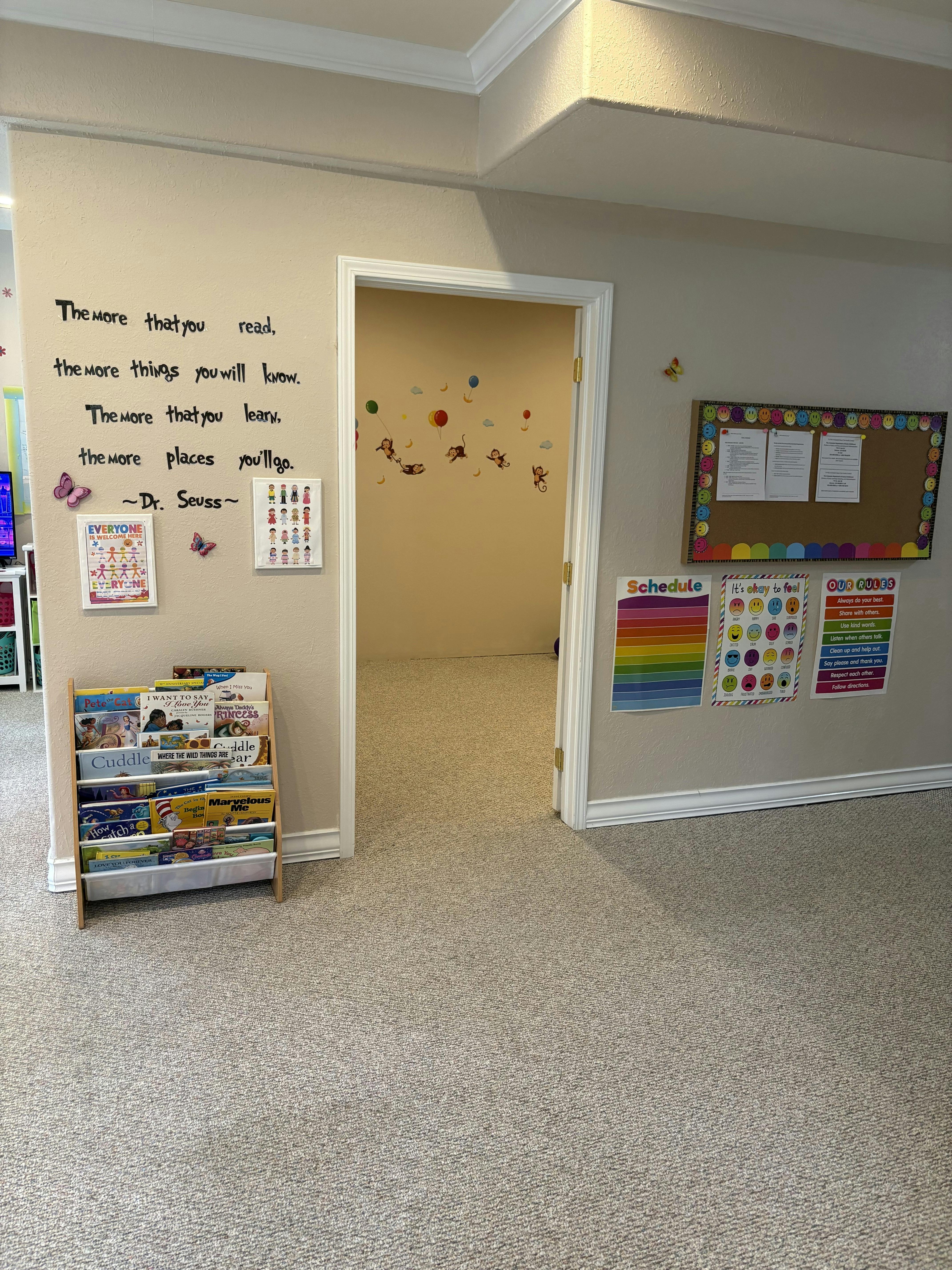 Classroom wall with books and posters featuring Dr Seuss quote