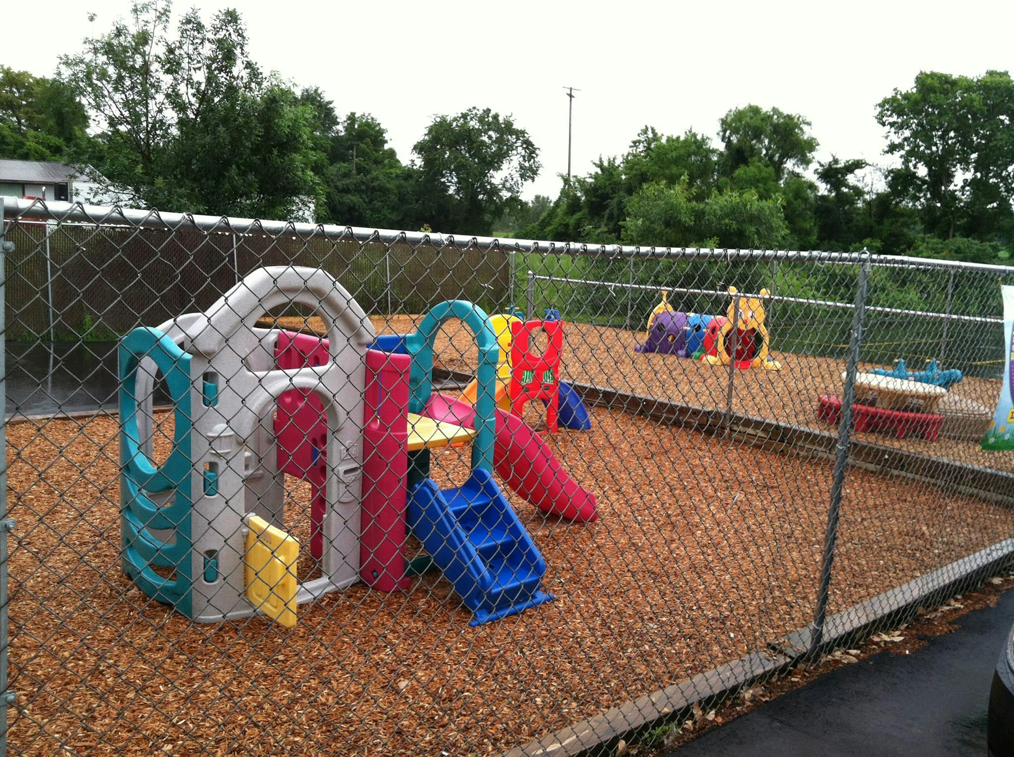 Playground with colorful play structure and wood chips