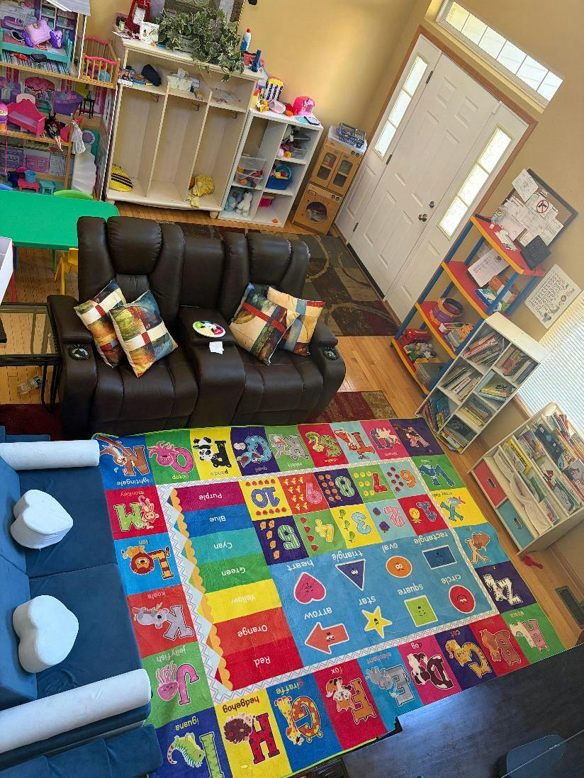 Colorful educational rug with letters and shapes in a children playroom