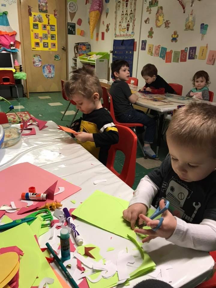 Children doing crafts in a classroom