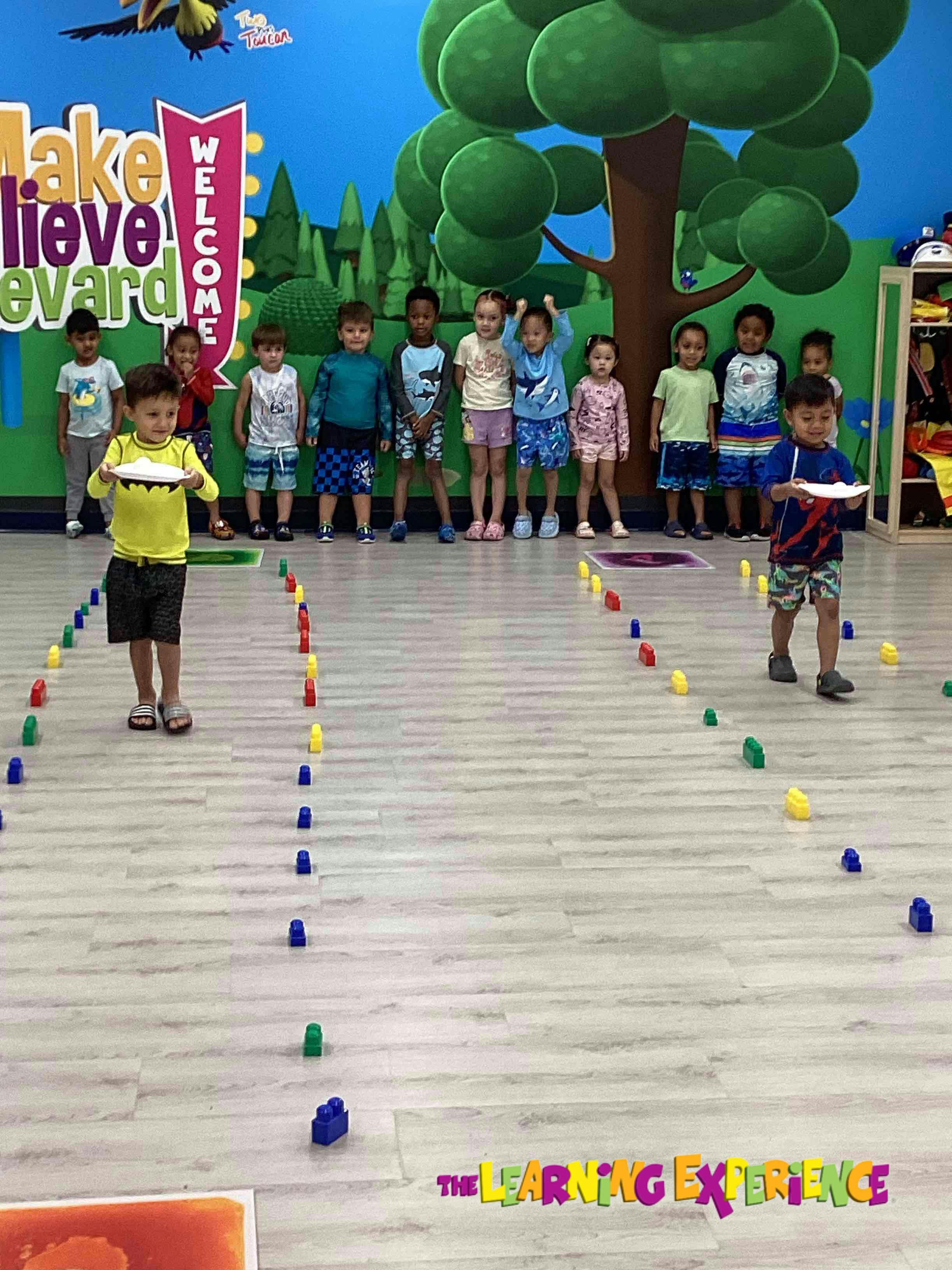 Children playing a game with cones on the floor