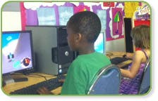 Child at a computer in a classroom