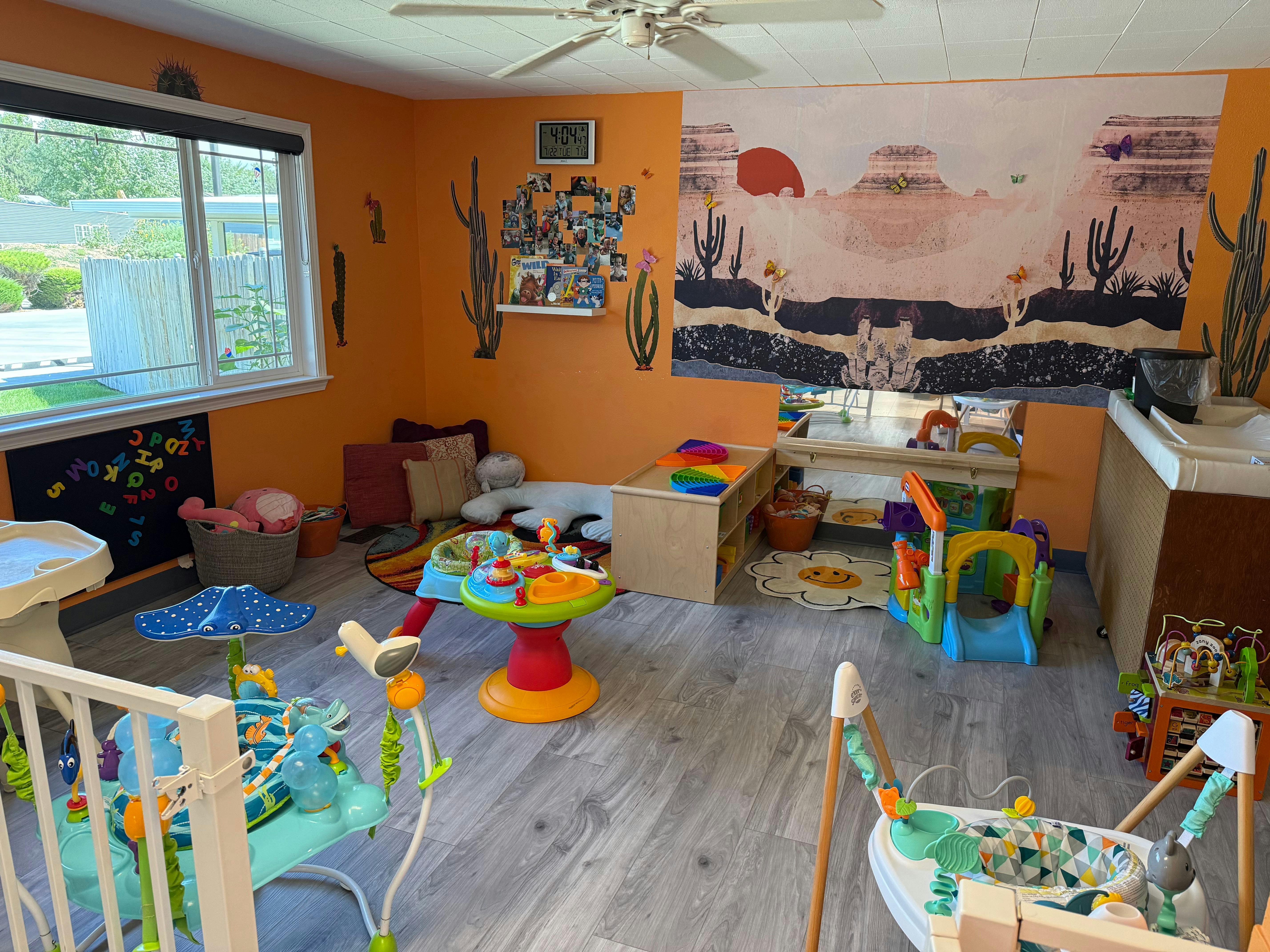 Playroom with various colorful toys and play structures