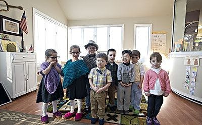 Group of children standing together indoors