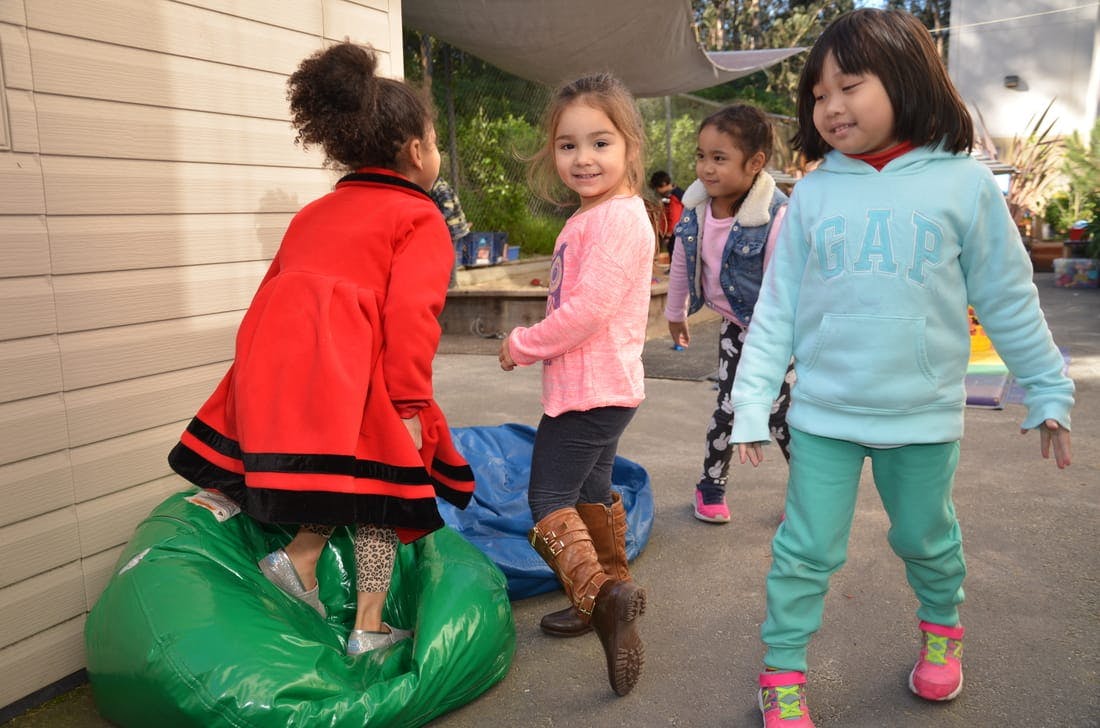 Four children playing outdoors