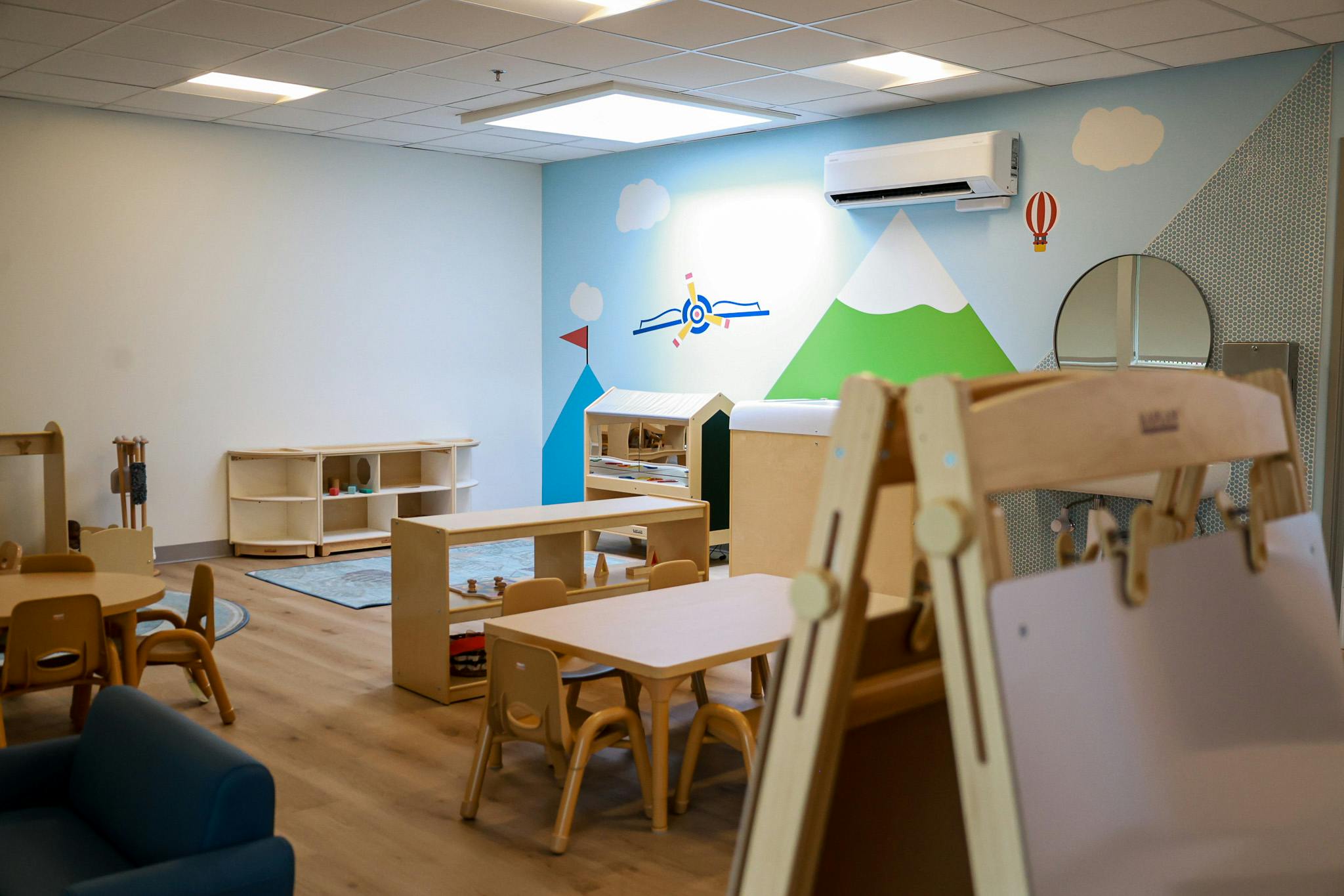 Classroom interior with small tables and chairs for children