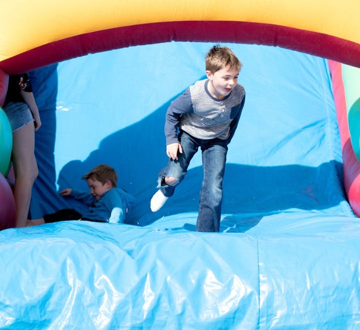 Children playing in an inflatable bounce house