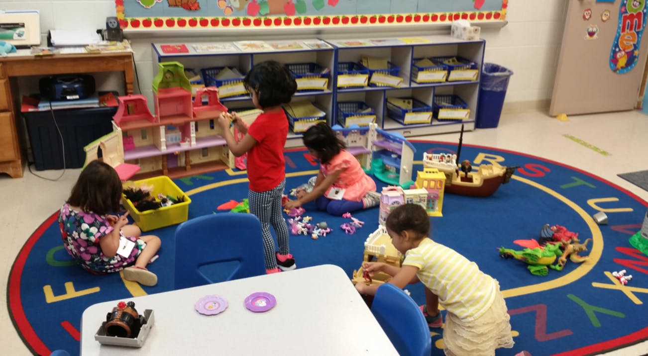 Children playing with toys in a classroom