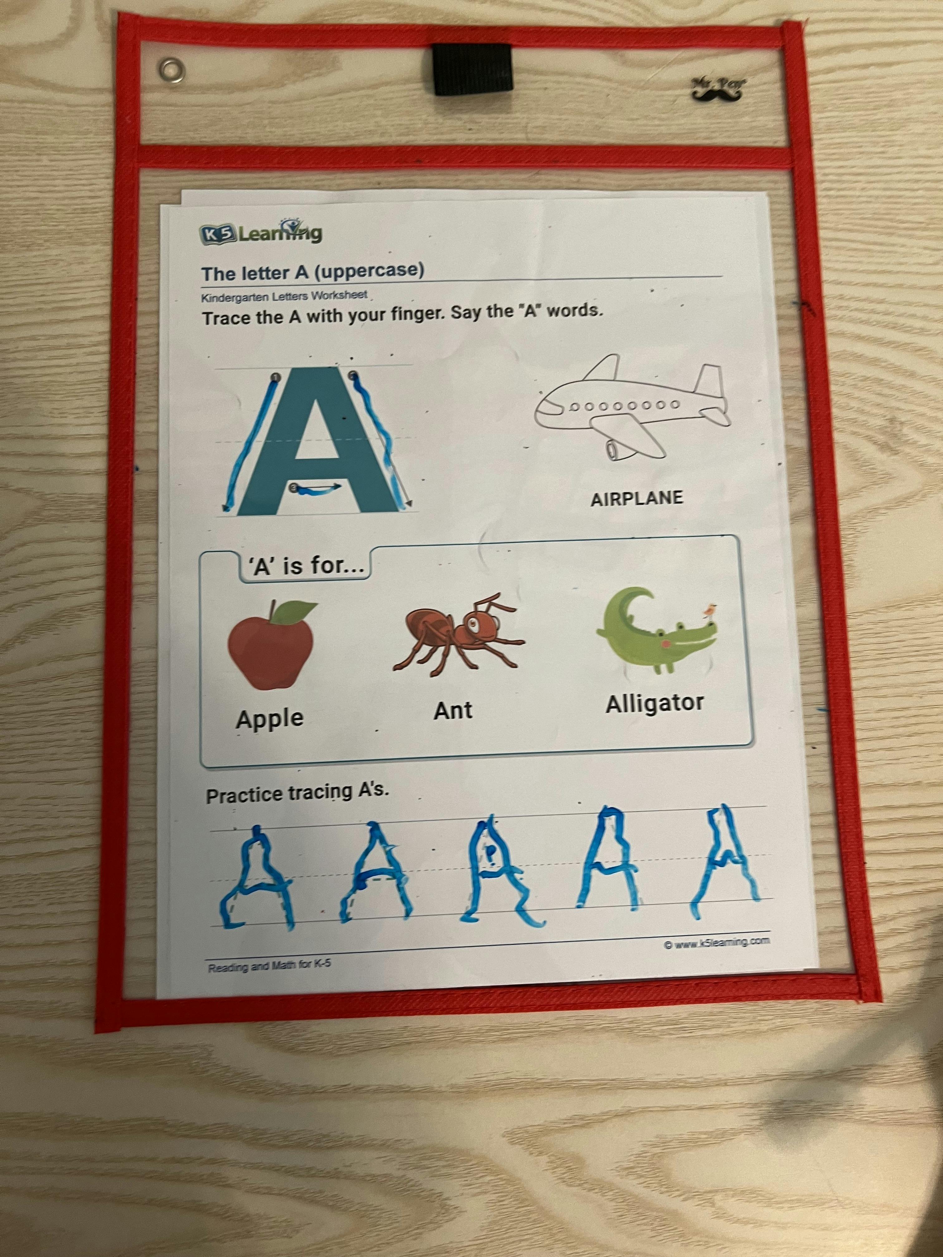 Kindergarten letter A tracing worksheet with images of airplane, apple, ant, alligator