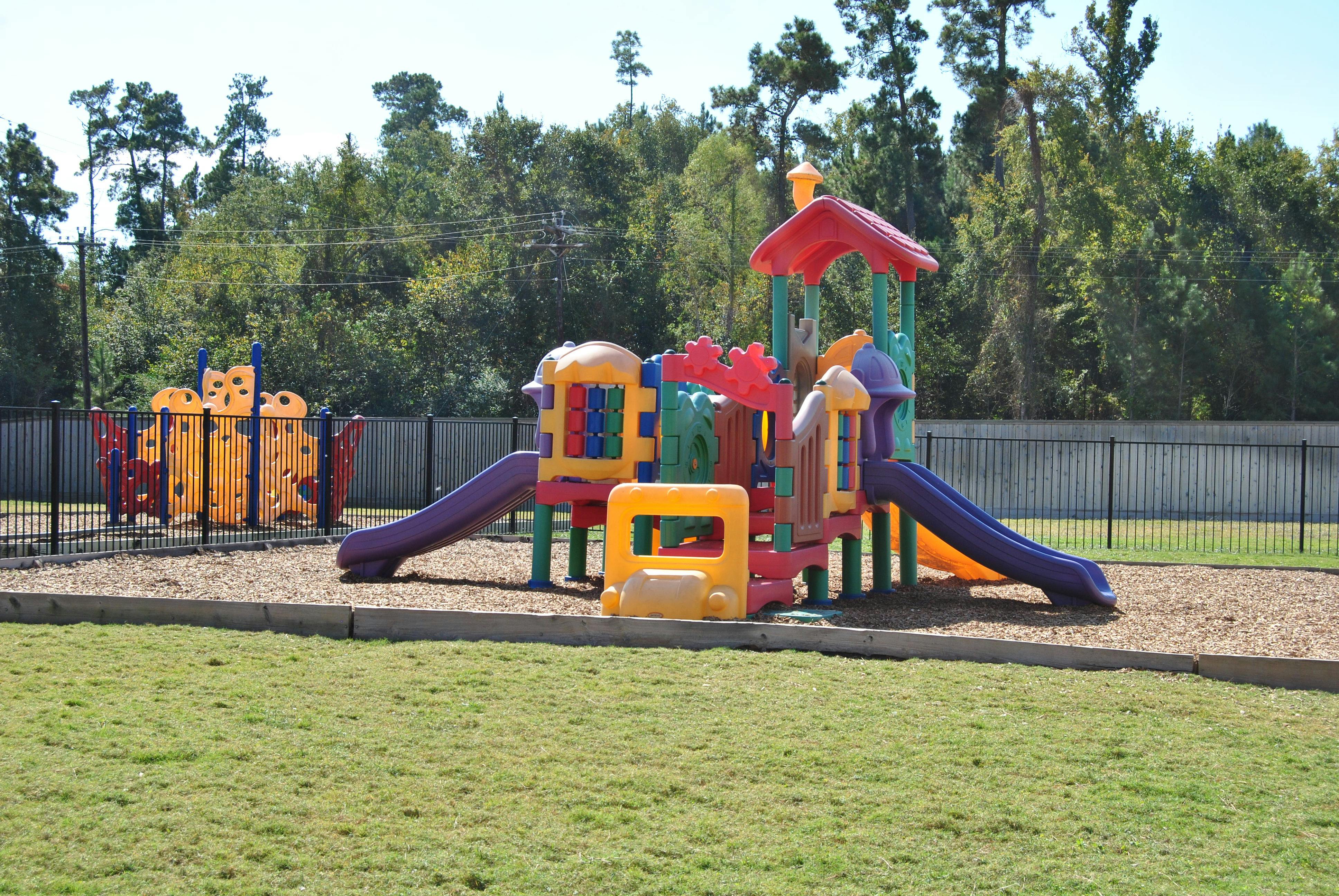 Colorful playground equipment with slides and climbing structures