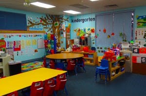 Kindergarten classroom with tables and chairs