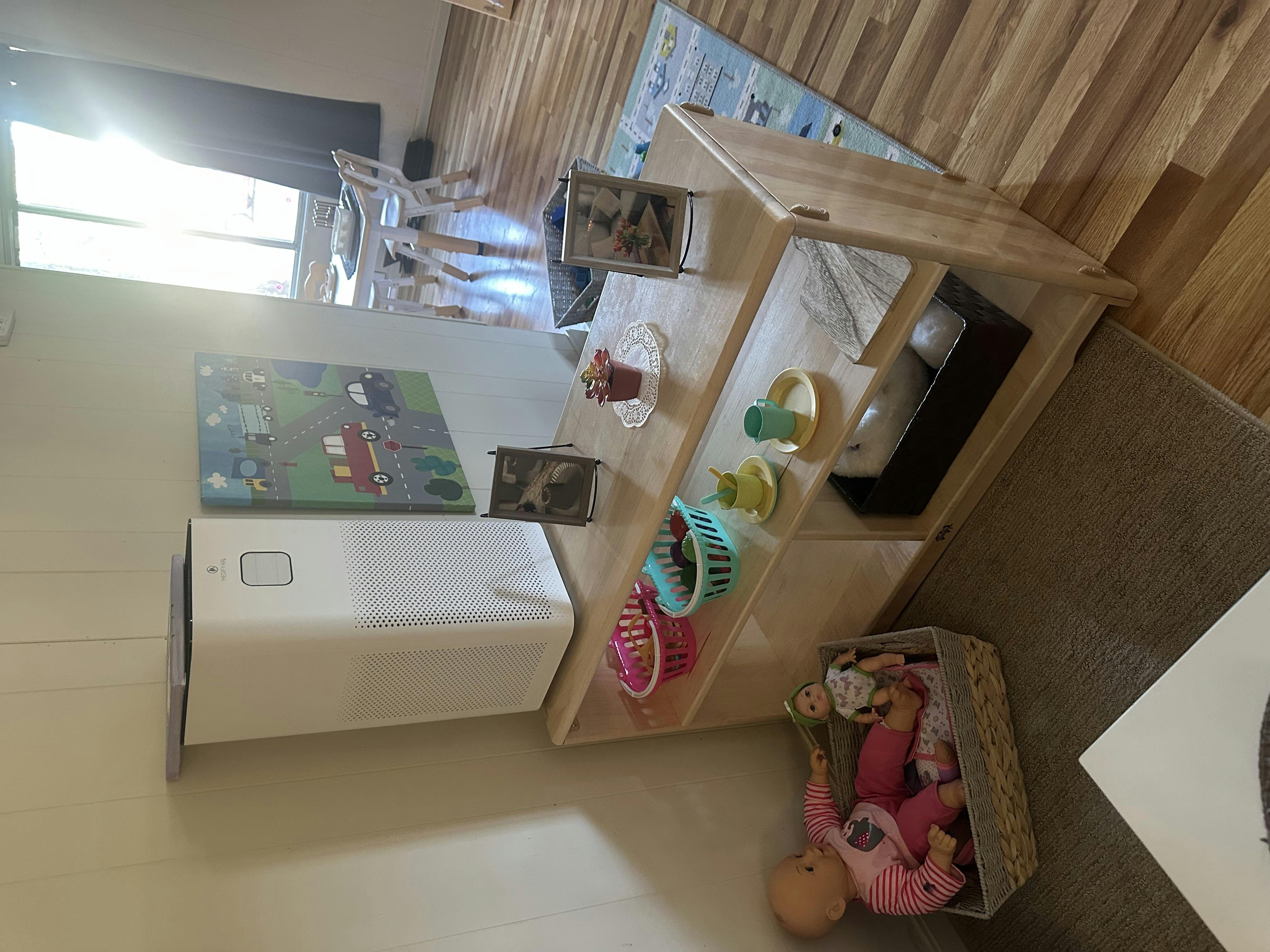 Playroom with a small wooden table and toys