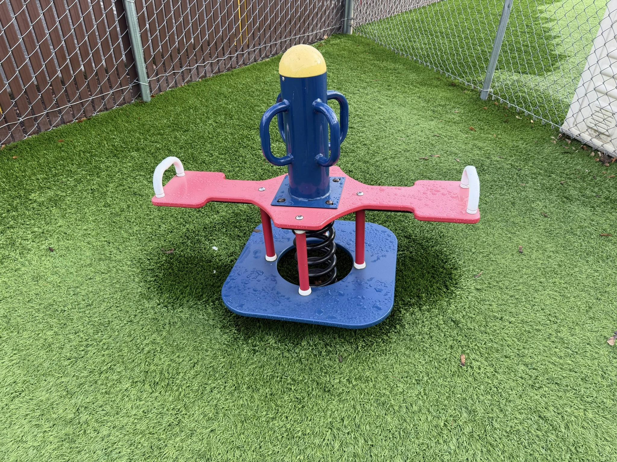Spring rider on artificial turf