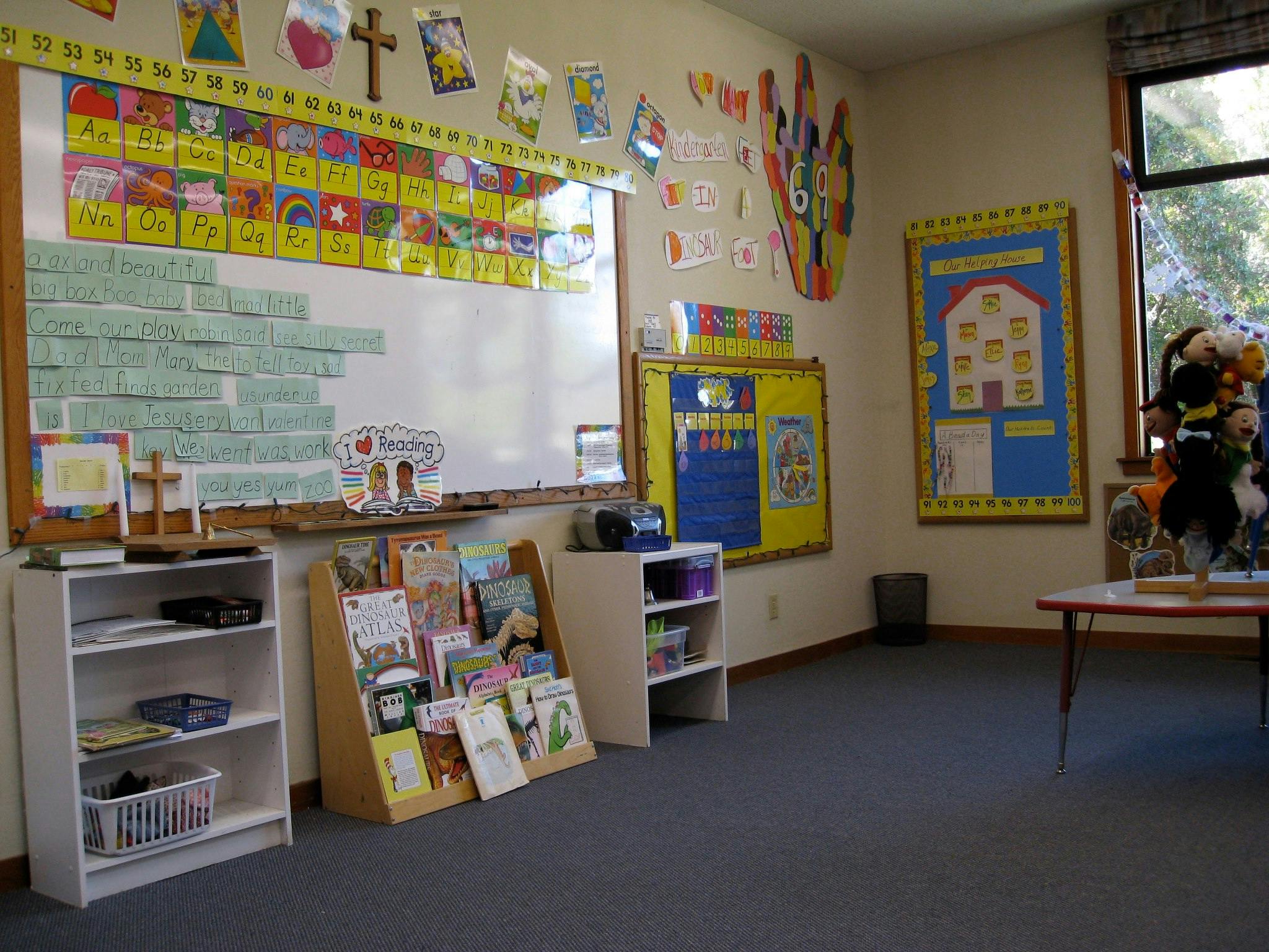 Classroom with whiteboard, bookshelves, and colorful decorations