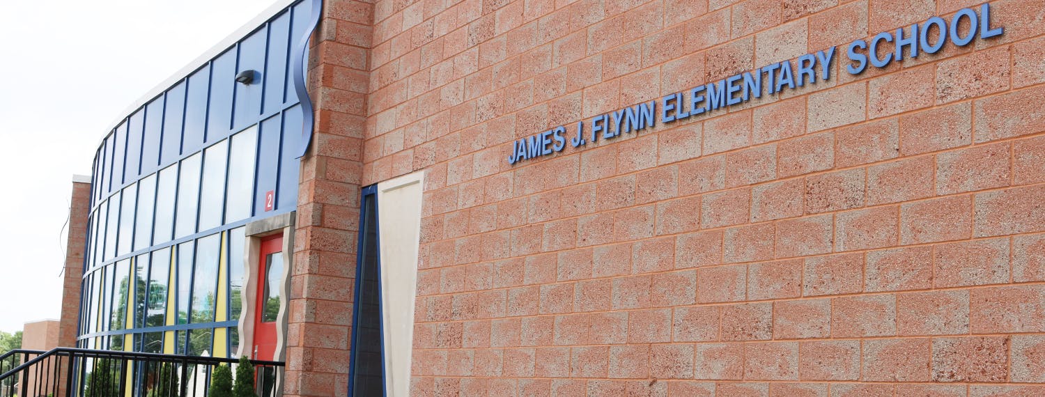 Building with sign "JAMES A FLYNN ELEMENTARY SCHOOL"