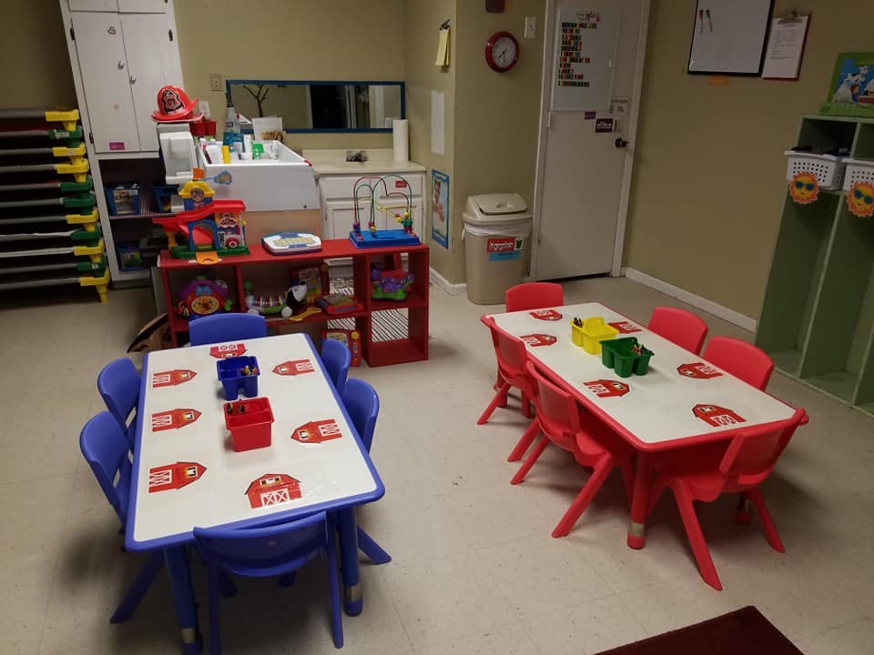 Two tables with chairs in a classroom